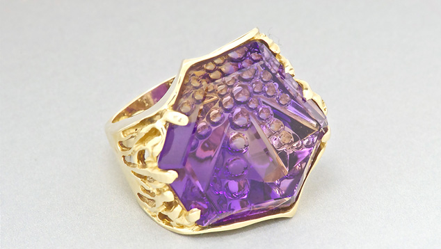 This 18K gold ring boasts a 52.62-ct. ametrine Dreamscape ™ cut by gem designer John Dyer. A gem of this size demands a bold design like this very handsome ring. Courtesy Cassanova's Jewelry