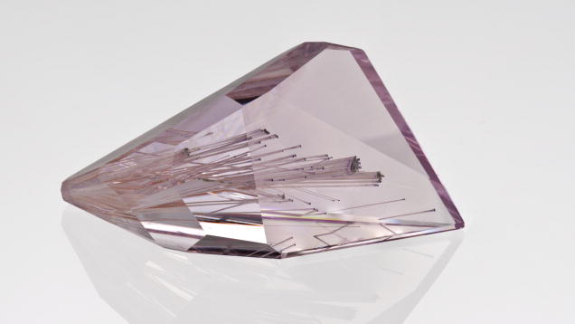 Kunzite. The cutter of this kunzite made creative use of the needle-like inclusions by making them into a design element. - Orasa Weldon