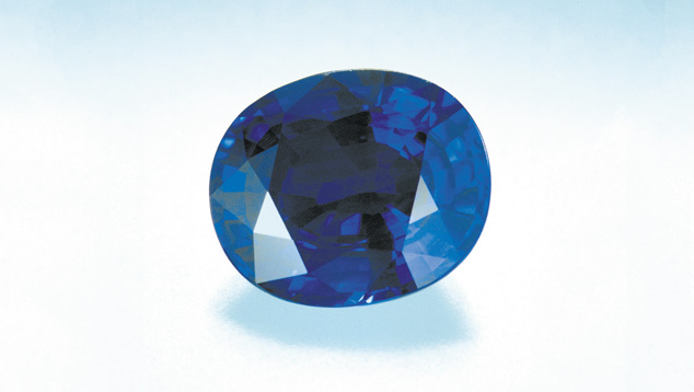Oval-cut Sapphire. Oval shapes with triangular and kite-shaped facets on the gem's crown (top portion) and parallel rectangular facets on the gem's pavilion (bottom portion) are very common for corundum of all colors. Photo: Robert Weldon/GIA. Courtesy: Lewis Allen