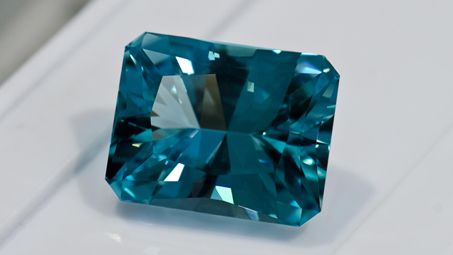 Faceted Aquamarine. This very greenish aquamarine cabochon has enough parallel inclusions to display a cat’s-eye.