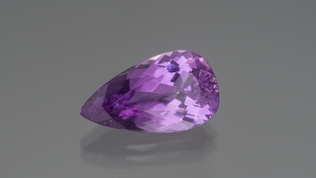 Kunzite. This lovely faceted kunzite displays an example of the best color this gem has to offer. - Robert Weldon