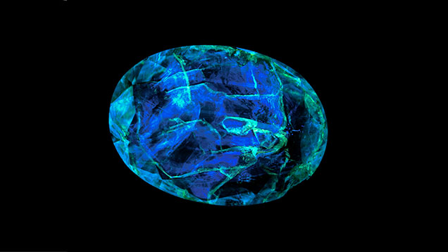 Fluorescent epoxy filling in emerald gemstone Fluorescent epoxy filling in emerald gemstone