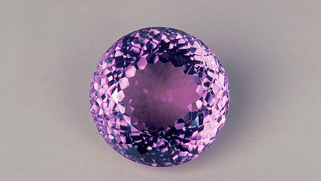 Round-Brilliant Cut Kunzite. This round kunzite displays a lovely, lively brilliant cut.
