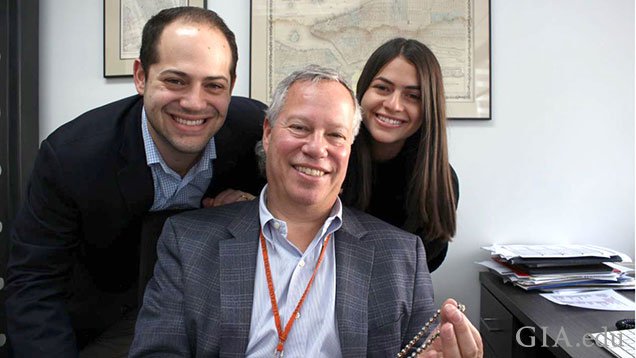 A group photo with Alan Nacht flanked by his son and daughter.