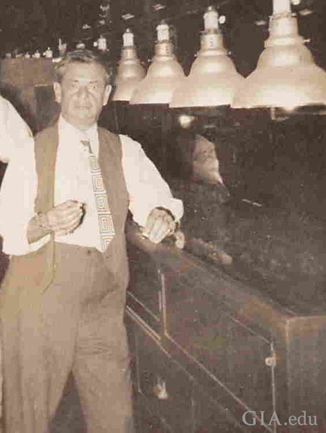 Bernard Nacht stands at the counter in his jewelry store.