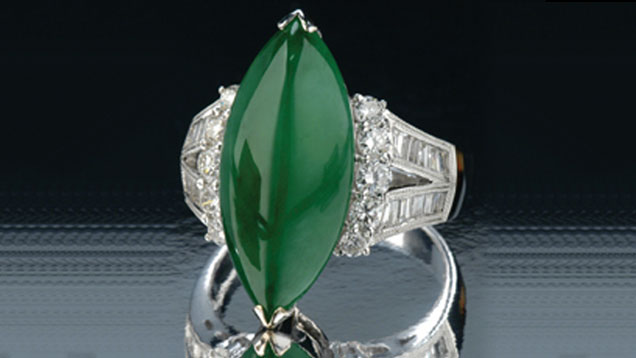 Marquise-shaped Jade Ring. Cabochons of various shapes, bangle bracelets, and round or carved beads are the most common jadeite jewelry styles. The deep, even, green color of this cabochon is far from common, however. - Gift of Sophie Leu