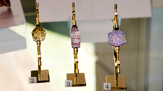 Carved Kunzite Gem - Quality Factors. These gems were carved by Dalan Hargrave. The gem in the center is a kunzite. The others are varieties of quartz: #2 is a citrine and #4 is an ametrine. - Eric Welch, courtesy Dalan Hargrave