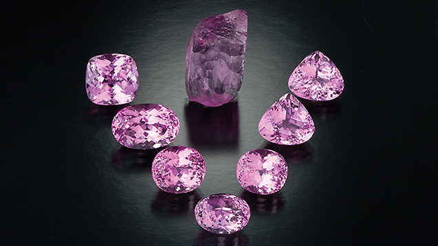 Kunzite Crystal and Faceted Stones. This kunzite crystal is accompanied by faceted kunzites ranging in weight from 12.47 to 19.32 carats. - Robert Weldon