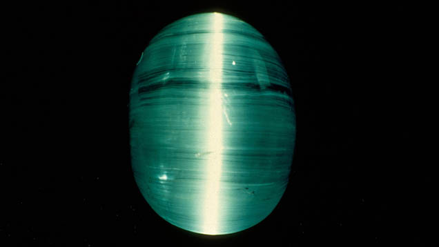 Greenish Aquamarine Cabochon. This very greenish aquamarine cabochon has enough parallel inclusions to display a cat’s-eye.
