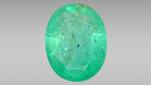 7.11 ct emerald with a large purple inclusion 7.11 ct emerald with a large purple inclusion