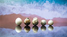 A row of five low-quality bead cultured pearls. A row of five low-quality bead cultured pearls.