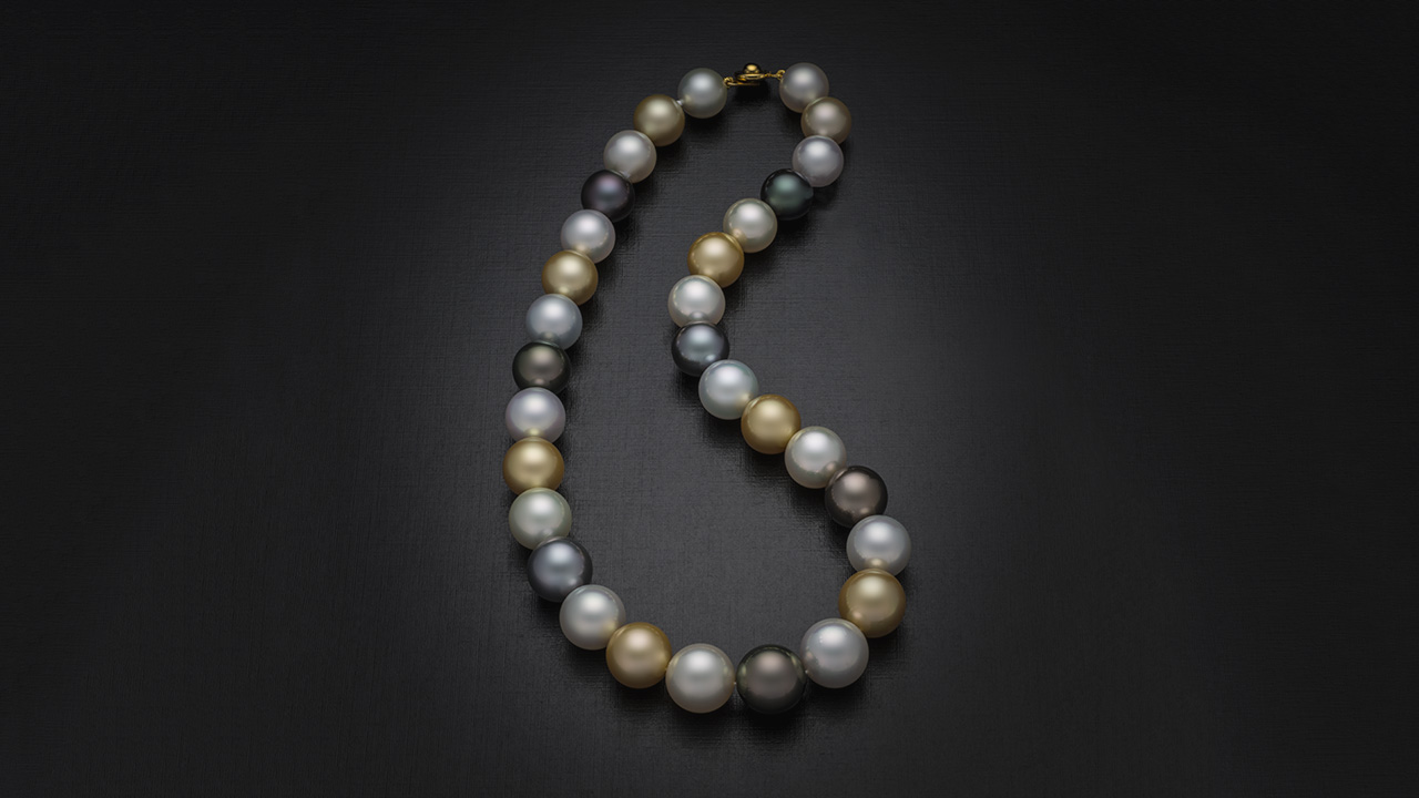 This very fine 12–14 mm multicolor necklace was assembled piece by piece using Australian, Philippine, and Tahitian cultured pearls. Each cultured pearl is matched for size and shape, and all have exceptional luster. Photo by Robert Weldon. This very fine 12–14 mm multicolor necklace was assembled piece by piece using Australian, Philippine, and Tahitian cultured pearls. Each cultured pearl is matched for size and shape, and all have exceptional luster. Photo by Robert Weldon.