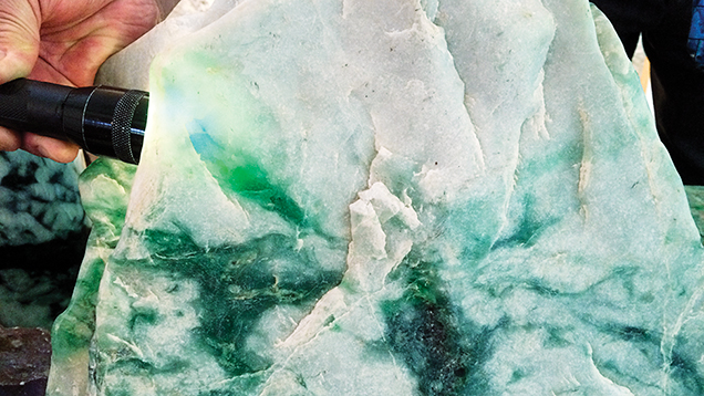 Jadeite boulder from Itoigawa, Japan. Figure 1. A large, attractive jadeite boulder from Itoigawa, Japan, characterized by mixed white and green colors. This boulder weighs 40.5 kg and measures approximately 39 cm high, 32 cm long, and 26 cm wide. Photo by Ahmadjan Abduriyim.