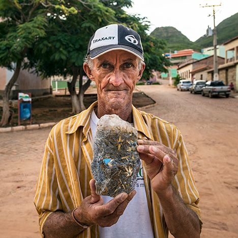 Miner with rutilated quartz.
