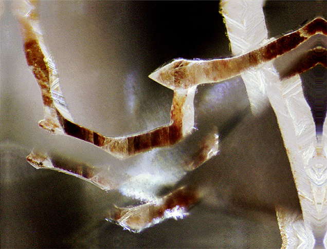Etch channel with pyramidal termination.
