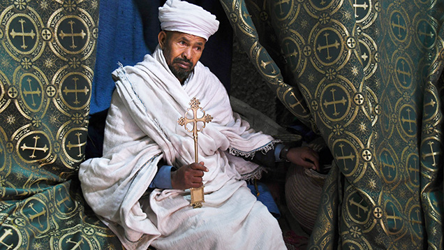 Priest at the Church of Saint George in Lalibela, Ethiopia Priest at the Church of Saint George in Lalibela, Ethiopia