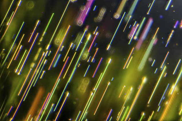 Colorful needle-like inclusions in pallasitic peridot.