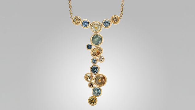 Figure 13. Faceted unheated Montana sapphires set in 18K gold. Photo by Orasa Weldon; courtesy of Diana Widman. Figure 13. Faceted unheated Montana sapphires set in 18K gold. Photo by Orasa Weldon; courtesy of Diana Widman.