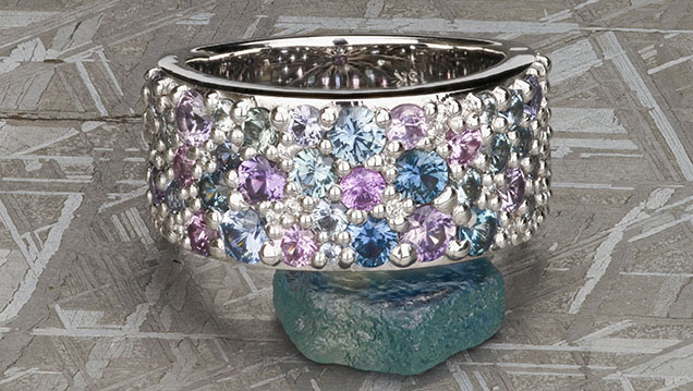 Figure 14. This “Twilight” ring showcases some of the common range of colors seen in Montana sapphire. The sapphires are unheated, with 3.80 total carat weight. Photo courtesy of Earth’s Treasury. Figure 14. This “Twilight” ring showcases some of the common range of colors seen in Montana sapphire. The sapphires are unheated, with 3.80 total carat weight. Photo courtesy of Earth’s Treasury.