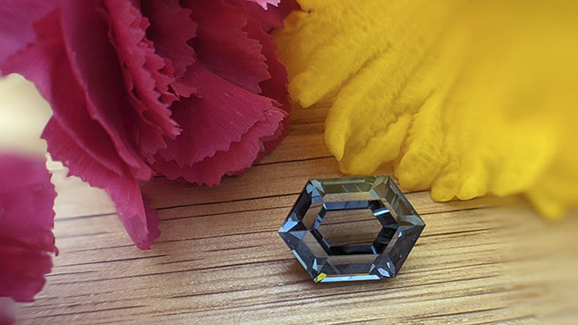 Figure 18. With their nonstandard colors, Montana sapphires have become popular for cutters experimenting with nontraditional cutting techniques. This 4.17 ct unheated sapphire cut by Nadine Marshall was sourced from the Missouri River. Courtesy of Obsessed Over Gems. Figure 18. With their nonstandard colors, Montana sapphires have become popular for cutters experimenting with nontraditional cutting techniques. This 4.17 ct unheated sapphire cut by Nadine Marshall was sourced from the Missouri River. Courtesy of Obsessed Over Gems.