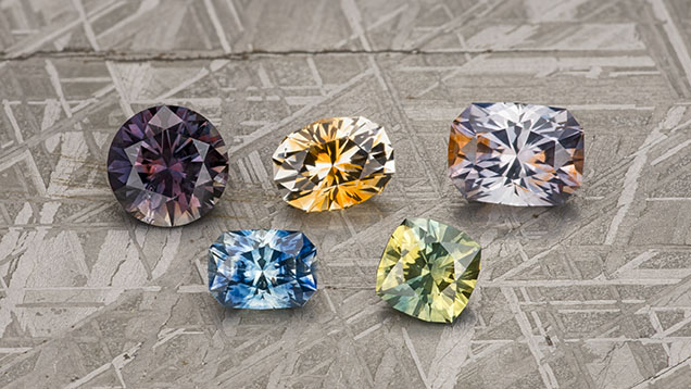 Figure 20. Parti-colored sapphires are occasionally found in Montana and can combine a wide range of colors. These examples, ranging from 1.62 to 3.20 ct, are all heated. Photo by Jeffrey R. Hapeman. Figure 20. Parti-colored sapphires are occasionally found in Montana and can combine a wide range of colors. These examples, ranging from 1.62 to 3.20 ct, are all heated. Photo by Jeffrey R. Hapeman.