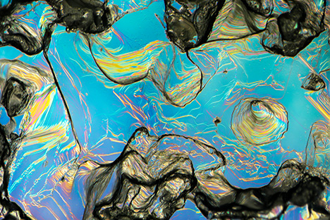 Figure 25. Hillocky structure on the surface of a rough sapphire from Rock Creek shown with differential interference contrast imaging. Photomicrograph by Aaron Palke; field of view 2.88 mm. Figure 25. Hillocky structure on the surface of a rough sapphire from Rock Creek shown with differential interference contrast imaging. Photomicrograph by Aaron Palke; field of view 2.88 mm.