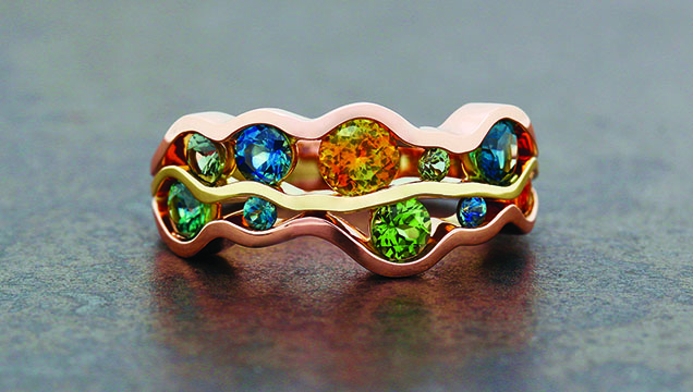 Figure 4. This “Fiume” ring features a wide range of colors seen in Montana sapphire. The sapphires are all heat treated, with 2.07 total carat weight. Photo courtesy of Raintree Jewelry. Figure 4. This “Fiume” ring features a wide range of colors seen in Montana sapphire. The sapphires are all heat treated, with 2.07 total carat weight. Photo courtesy of Raintree Jewelry.