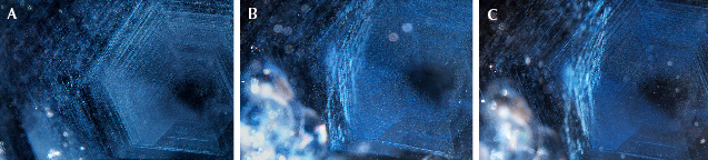 Figure 51. Rutile silk and particles in example 4 in the unheated (A), heated (slowly cooled, B), and heated (rapidly cooled, C) states showing the existence of rutile particles even in the heated and rapidly cooled sapphire. Photomicrographs by Aaron Palke; field of view 3.57 mm. Figure 51. Rutile silk and particles in example 4 in the unheated (A), heated (slowly cooled, B), and heated (rapidly cooled, C) states showing the existence of rutile particles even in the heated and rapidly cooled sapphire. Photomicrographs by Aaron Palke; field of view 3.57 mm.