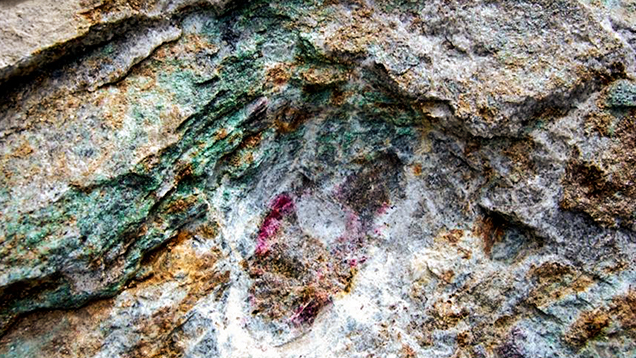 An outcrop of ruby-bearing micaceous lenses within marble in Snezhnoe, Tajikistan. An outcrop of ruby-bearing micaceous lenses within marble in Snezhnoe, Tajikistan.