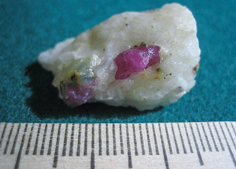 Ruby crystals within a calcitic marble at Snezhnoe, Tajikistan Ruby crystals within a calcitic marble at Snezhnoe, Tajikistan
