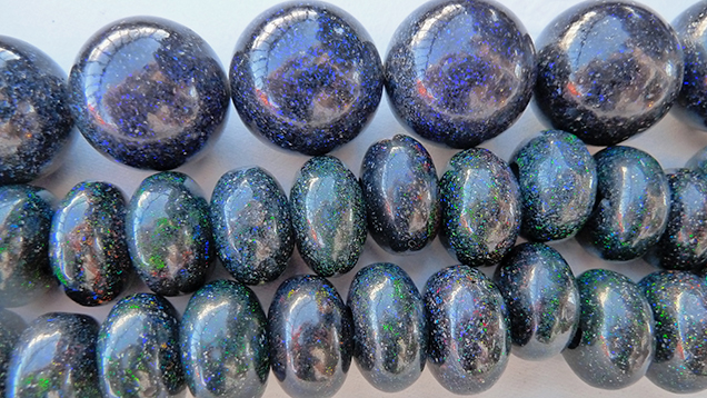 SU16-GNI-Figure-28_203493-636x358.jpg. Opal beads with blue play-of-color.