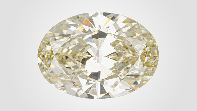 Figure 1. This 3.07 ct HPHT-treated CVD-grown diamond received a color grade of brownish greenish yellow, with the causes of color including isolated nitrogen and SiV– centers. Photo by Diego Sanchez. Figure 1. This 3.07 ct HPHT-treated CVD-grown diamond received a color grade of brownish greenish yellow, with the causes of color including isolated nitrogen and SiV– centers. Photo by Diego Sanchez.