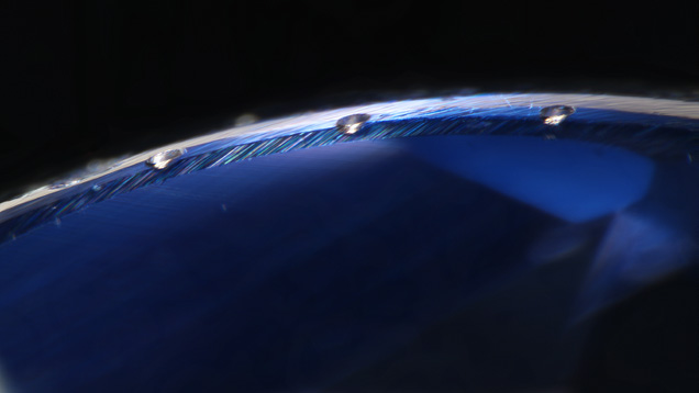 Laser ablation spots on girdle of a synthetic sapphire Laser ablation spots on girdle of a synthetic sapphire