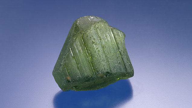 Figure 11. A 69.30 g (346.5 ct) peridot crystal from Zabargad (Saint John’s) Island in the Red Sea. Photo by Robert Weldon. Figure 11. A 69.30 g (346.5 ct) peridot crystal from Zabargad (Saint John’s) Island in the Red Sea. Photo by Robert Weldon.