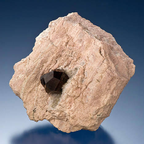 Figure 14. An almandine garnet in rhyolite from Garnet Hill in White Pine County, Nevada. Photo by Robert Weldon. Figure 14. An almandine garnet in rhyolite from Garnet Hill in White Pine County, Nevada. Photo by Robert Weldon.