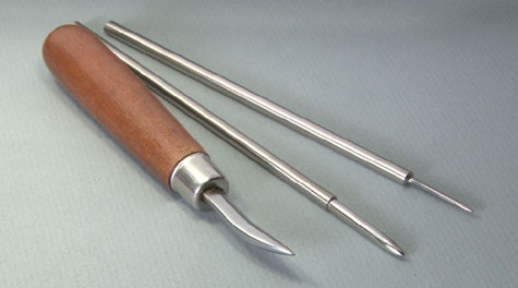 This one features a highly polished stainless steel tip with a curved, smooth surface. For ease of use, it’s mounted in a wooden handle. This tool is useful for burnishing light scratches in platinum ring shanks. This one features a highly polished stainless steel tip with a curved, smooth surface. For ease of use, it’s mounted in a wooden handle. This tool is useful for burnishing light scratches in platinum ring shanks.