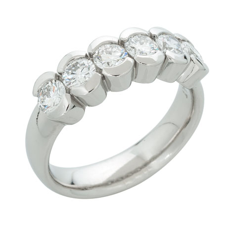 Perspective view of a substantial platinum ring with six matching partial-bezel set stones Perspective view of a substantial platinum ring with six matching partial-bezel set stones
