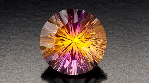 Bursts of yellow and purple radiate throughout this round cut amertrine. Bursts of yellow and purple radiate throughout this round cut amertrine.
