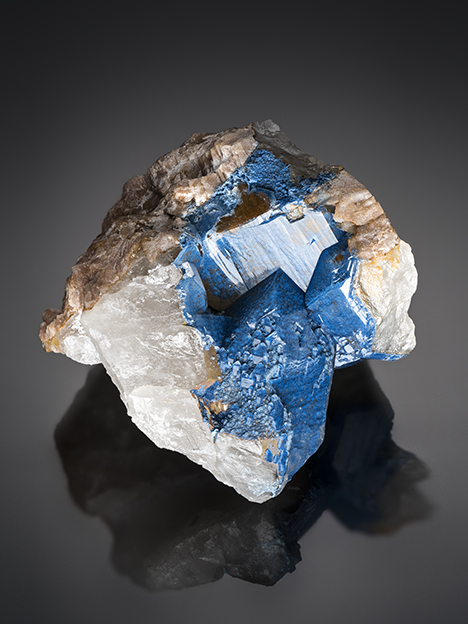 Shattuckite typically forms aggregates of circular to spherulitic masses composed of acicular crystals